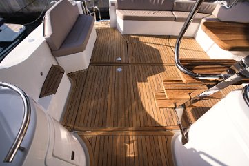 Teak Cockpit & Flybridge Access on Adriana 44 Fly Easy stairs leading to the flybridge and beautiful teak flooring in the cockpit.