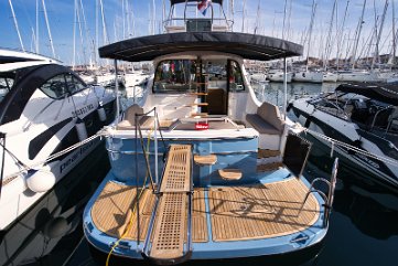 Ready for Boarding - 'Baby Blue' - Adriana 44 Fly Stern view showing the hydraulic gangway and easy access to the cockpit.