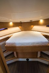 Master Cabin Island Bed Spacious owner's stateroom in the bow featuring a large central island bed.