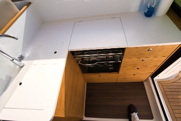 Fully Equipped Galley U-shaped galley featuring modern appliances and plenty of storage for your charter.