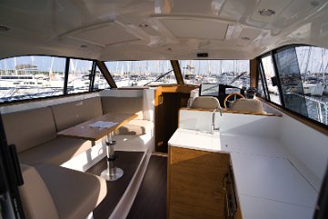 Open Concept Salon on Adriana 44 Fly View looking forward through the salon towards the helm and cabins.