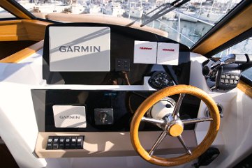 Captain's Command Center Garmin electronics and precise controls at the interior helm of the Adriana 44 Fly.