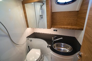 Marine Head & Shower Well-appointed bathroom with a washbasin and shower facilities.