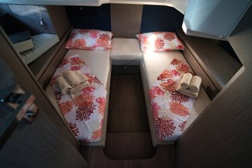 Gran Turismo 41 Guest Cabin - Twin Beds Aft guest cabin with two comfortable single beds, offering privacy for family or friends on this Beneteau yacht.