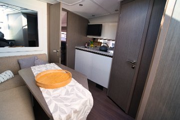 Salon Dining - Yacht 'Miami Vice' A cozy dining nook in the salon of the Gran Turismo 41, perfect for relaxing out of the sun.