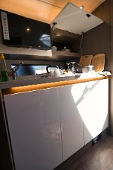 Galley Storage - Beneteau Gran Turismo 41 Smart storage solutions and a refrigerator integrated into the cabinetry of 'Miami Vice'.