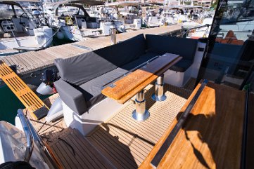 Spacious Cockpit & Al Fresco Dining Comfortable L-shaped seating and teak table in the cockpit, seamlessly connected to the salon.