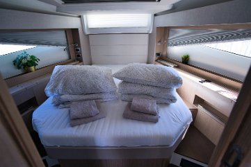 Master Cabin Island Bed Spacious forward owner's cabin on 'Tireless' with a comfortable island double berth and hull windows.