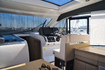 Salon to Cockpit Connection Bi-fold doors (if applicable) or sliding glass opens the salon fully to the aft deck.