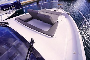 Sunbathing on Sealine F430 Large sunpads on the foredeck for relaxing and enjoying the sun.