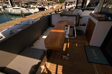 Cockpit Dining Area The L-shaped seating in the cockpit connects seamlessly with the salon and the sea.