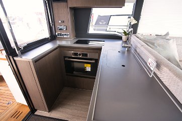 Galley Details - Sealine F430 Elegant finish and smart storage solutions for kitchenware and provisions.