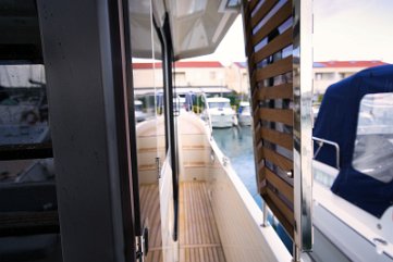 Safe Side Decks on Beneteau Swift Trawler 41 Wide, protected starboard walkway ensures safe movement from stern to bow for the whole crew.