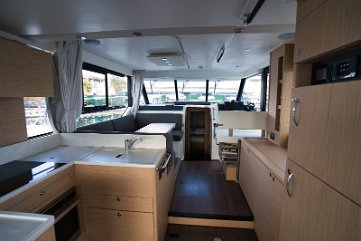Indoor Dining Area - Motor boat Swift Trawler 41 Fly Comfortable L-shaped seating and dining table in the salon, perfect for socialising on board.